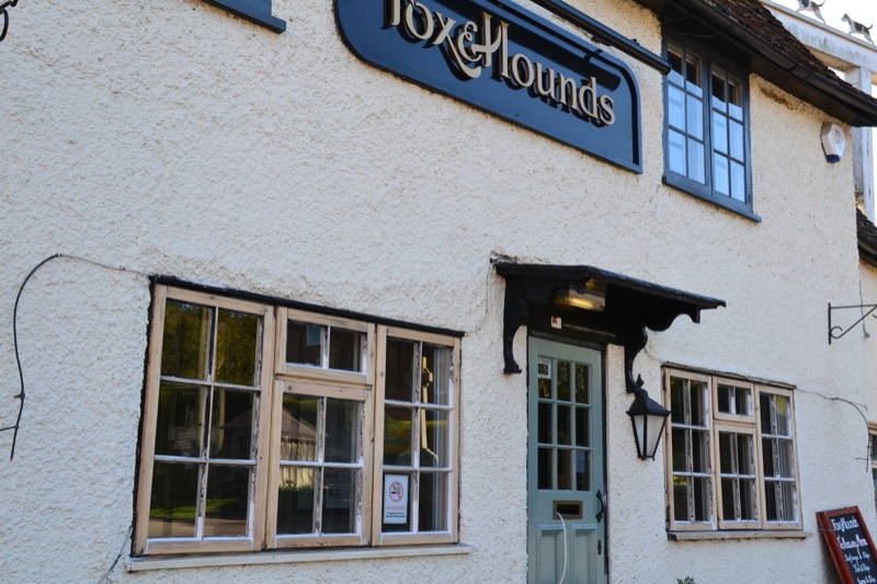 Repaired traditional timber windows on a village pub