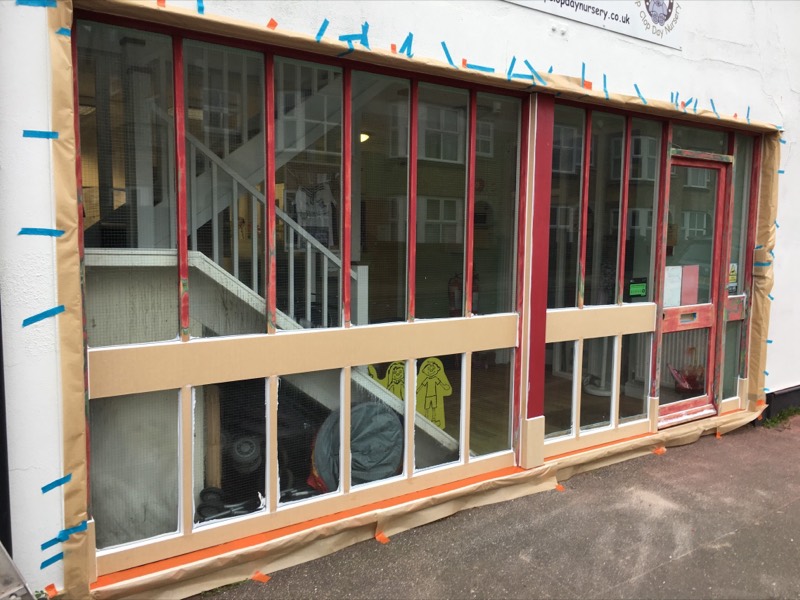 New timber spliced into a large wooden shop front during repair